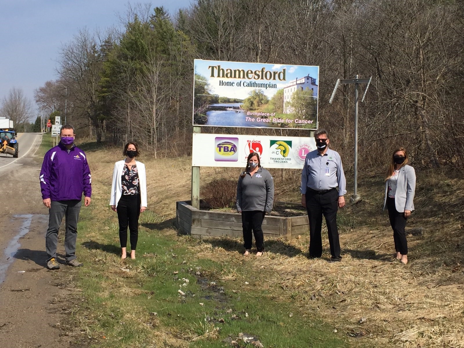 Members from Quadro and Township of Zorra in front of the Town Sign for Thamesford, Ontario for Connecting the Community of Thamesford announcement
